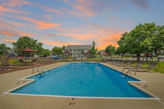 Florence Townhomes - Windridge Townhomes - Sparkling Pool with Sun Lounge Chairs, and View of Community