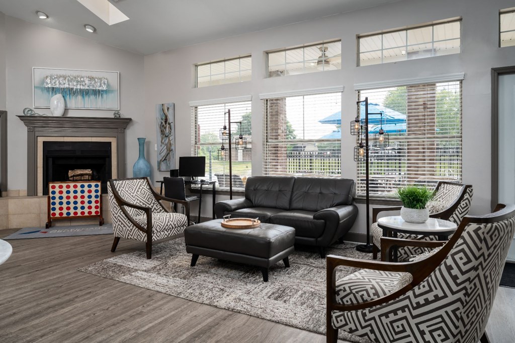 a living room filled with furniture and a large window