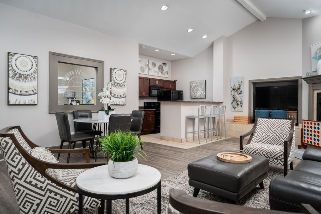 a living room filled with furniture and a fire place