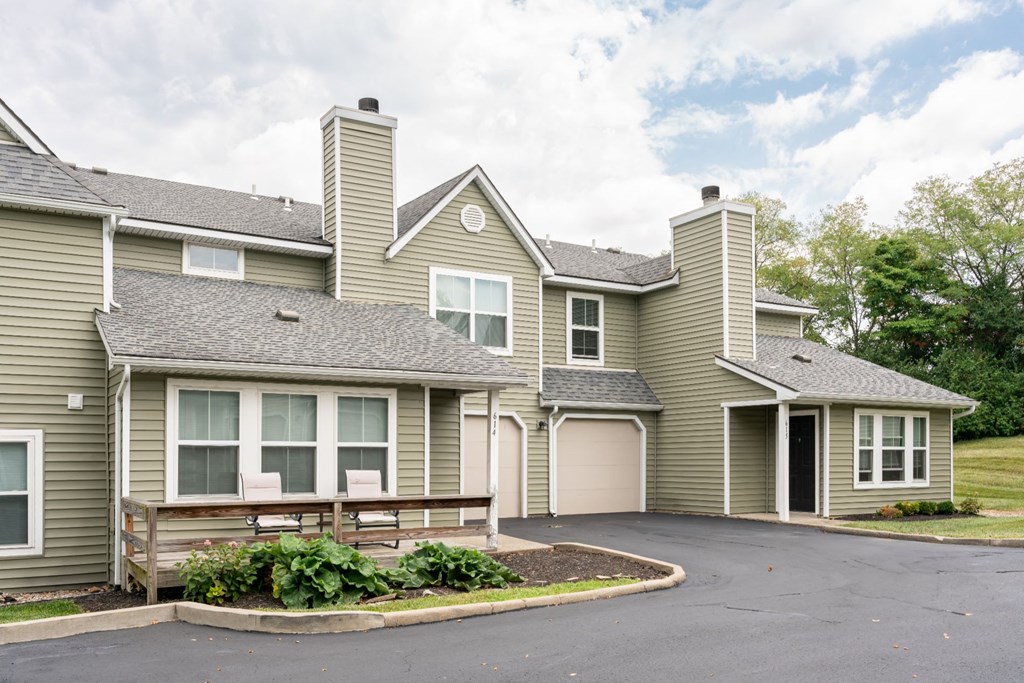 a large house with a garage and a driveway