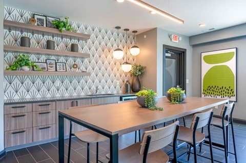 a dining room with a table and chairs