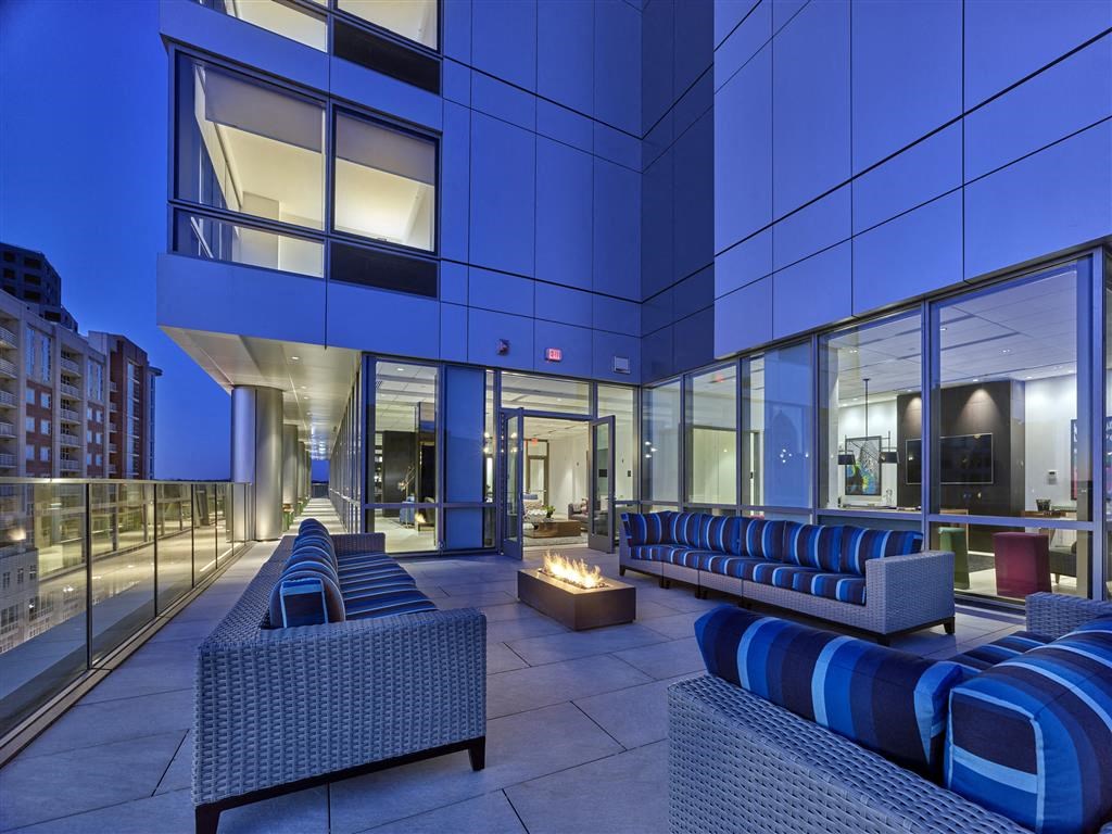 a lounge area at an office building with a fire pit