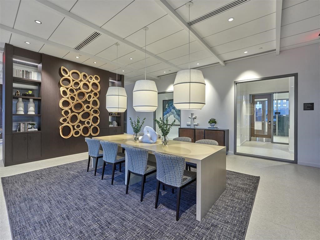 a dining room with a table and chairs