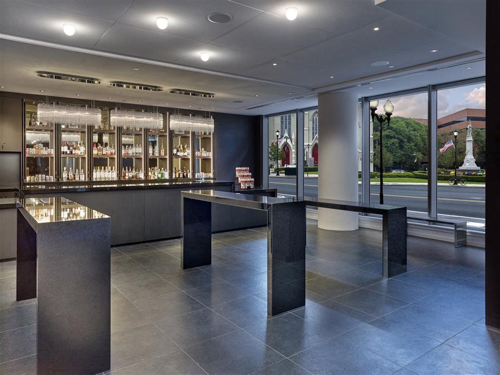 the lobby or reception area of a hotel with a bar