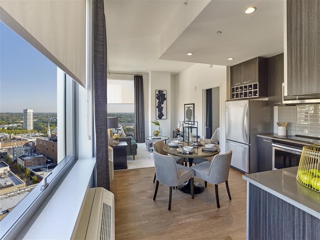 a kitchen and dining room with a view of the city