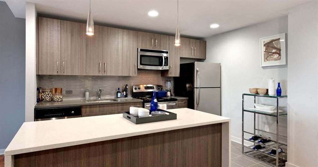 Kitchen with quartz countertops and stainless steel appliances