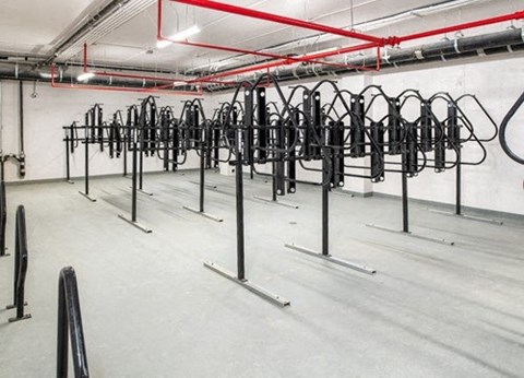a bunch of bikes are lined up in a gym