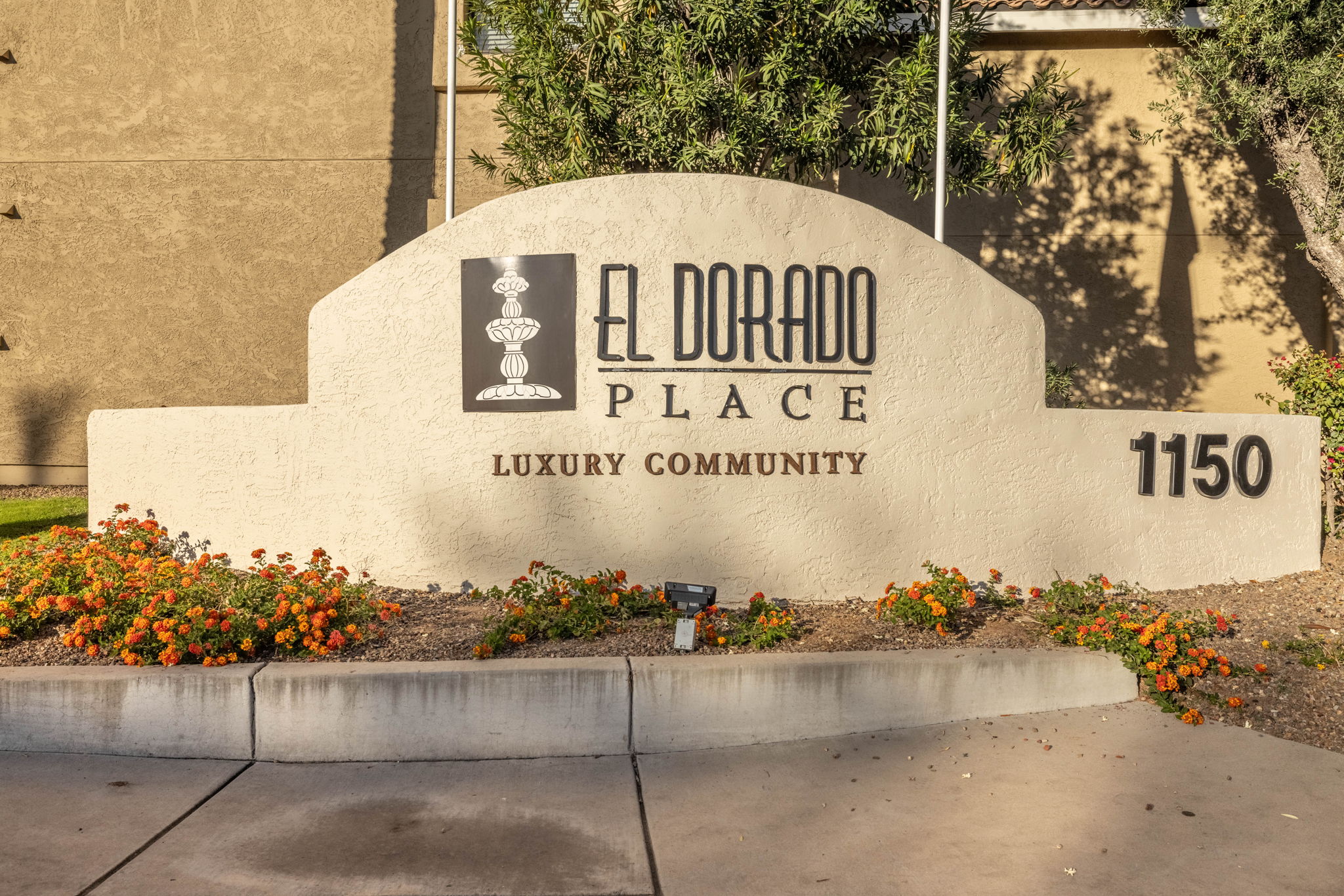 The El Dorado Place sign is in front of a building.