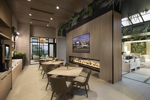 A modern dining room with a long table and chairs.
