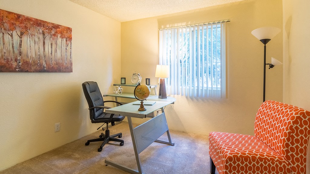 The Springs bedroom with carpet flooring and nice natural lighting