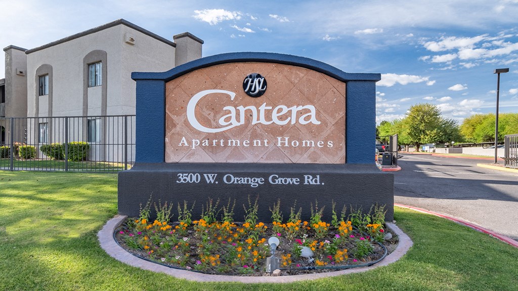 cantera community sign with lush landscape