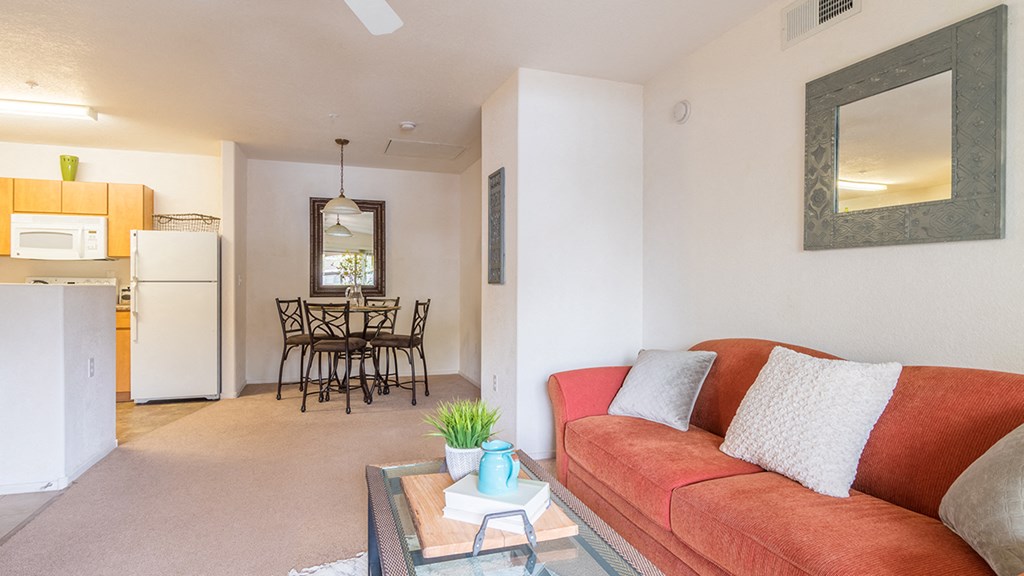 Desert Sands living room with carpet flooring.