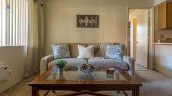 Canyon creek living room with z cozy couch and carpet flooring - Photo Gallery 7