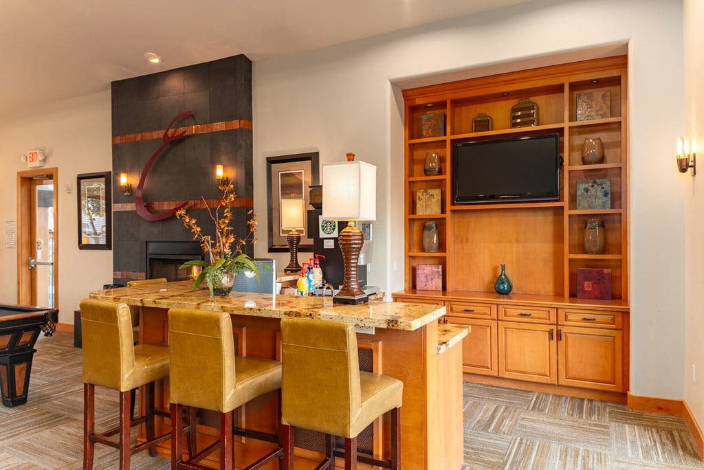 a living room filled with furniture and a flat screen tv