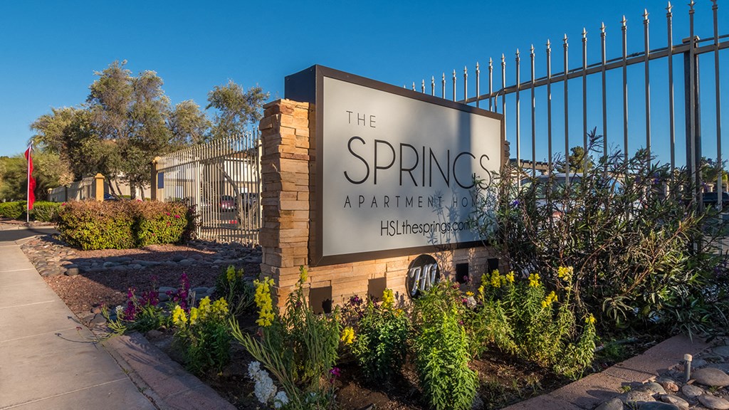 The Springs community sign with nice flowers planted all around
