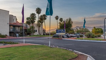 Camino Seco Village entrance with well kept road and community sign - Photo Gallery 31