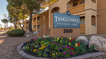 Tanglewood community sign with well kept entrance and flowers all around - Photo Gallery 25