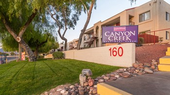 Canyon creek community sign with lush landscape and well kept pathway - Photo Gallery 19