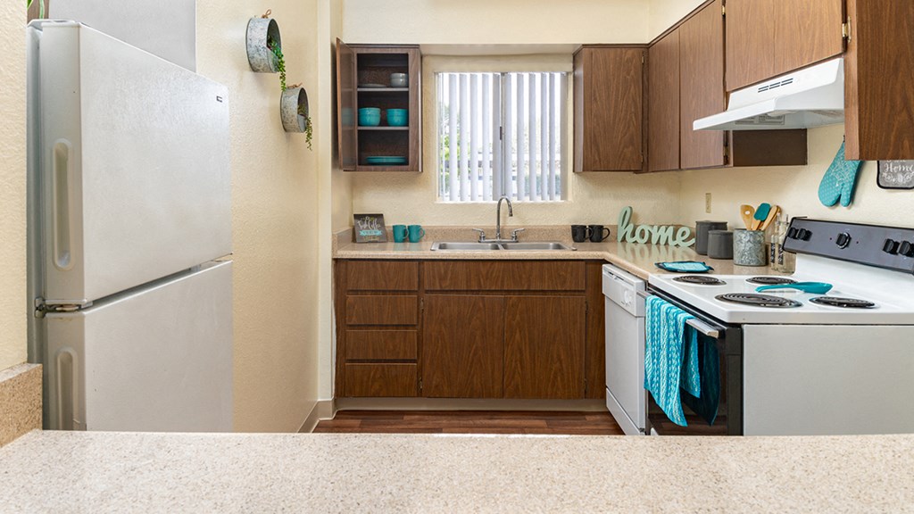 Cottonwood Creek spacious kitchen with light brown cabinetry.