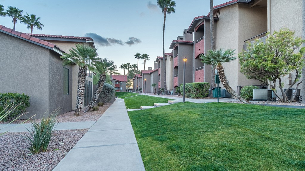 Enclave courtyard view with lush landscape