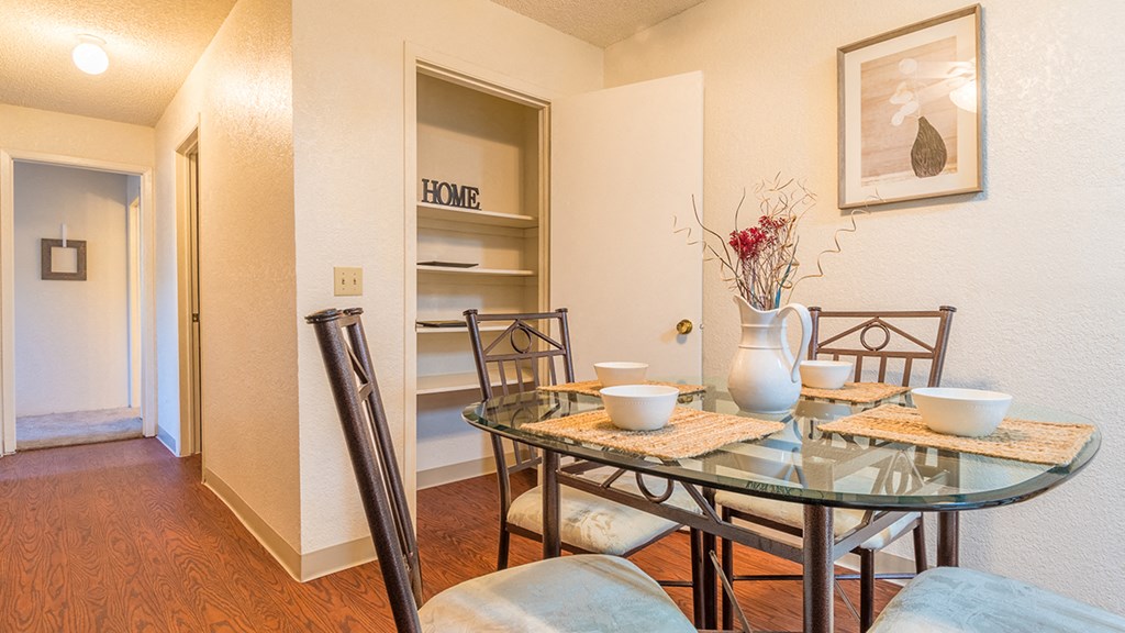Somerpointe dining area with nice lighting and wood flooring