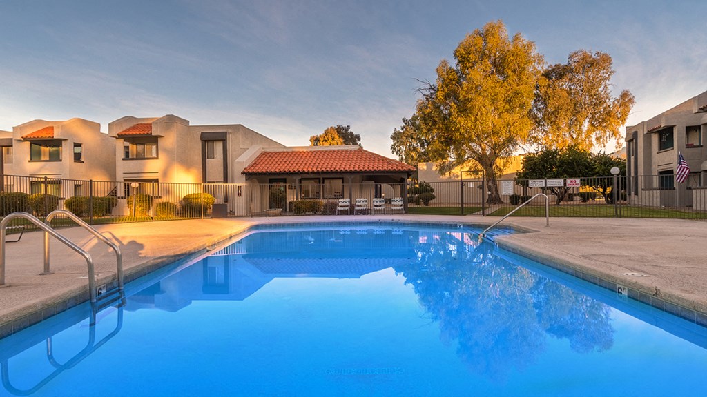 Riverstone pool view with nice view, and lounging area nearby