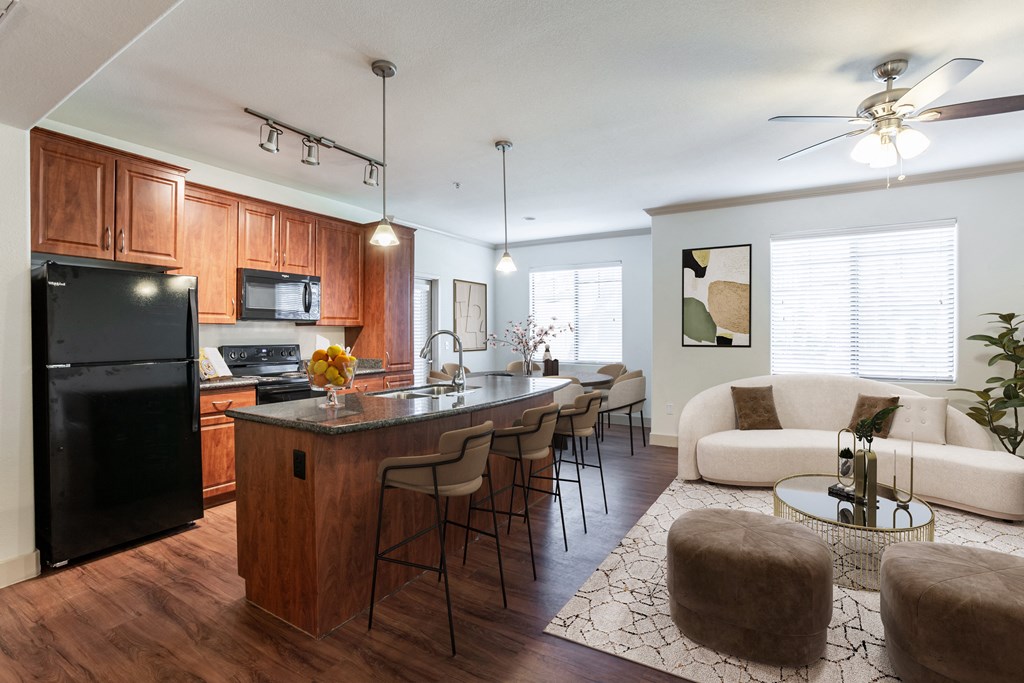 a kitchen and living room with a large island