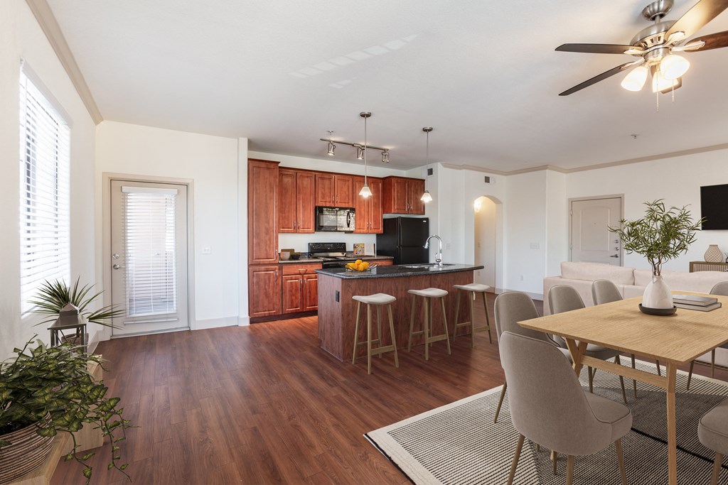 a kitchen and dining area in a 555 waverly unit