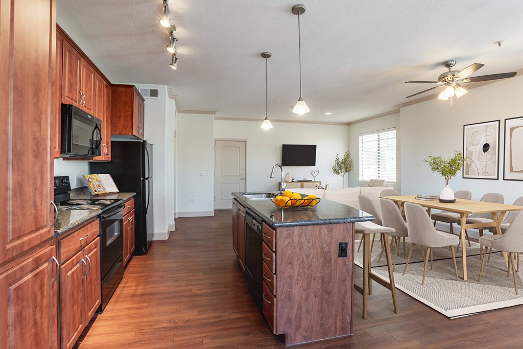 a kitchen and dining area in a 555 waverly unit