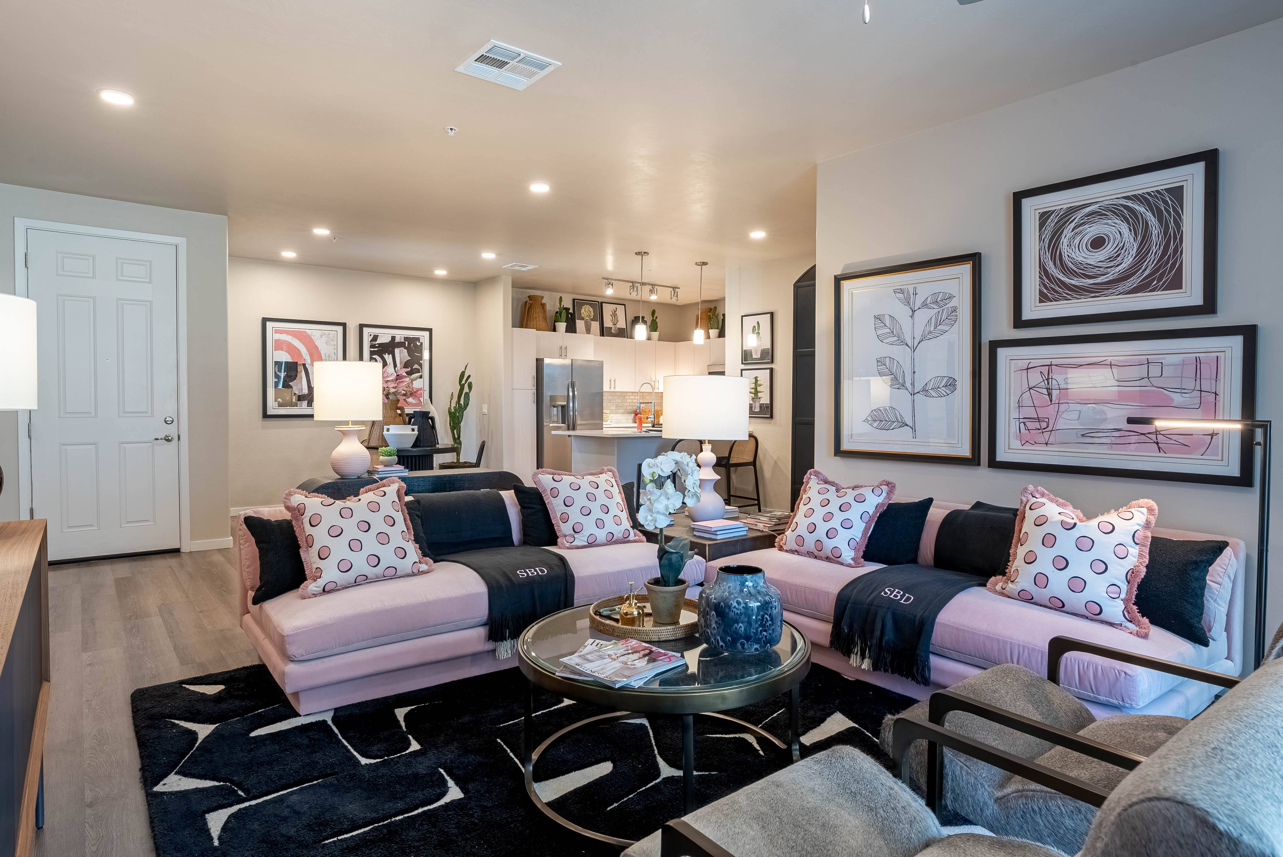 a living room with couches and chairs and a table