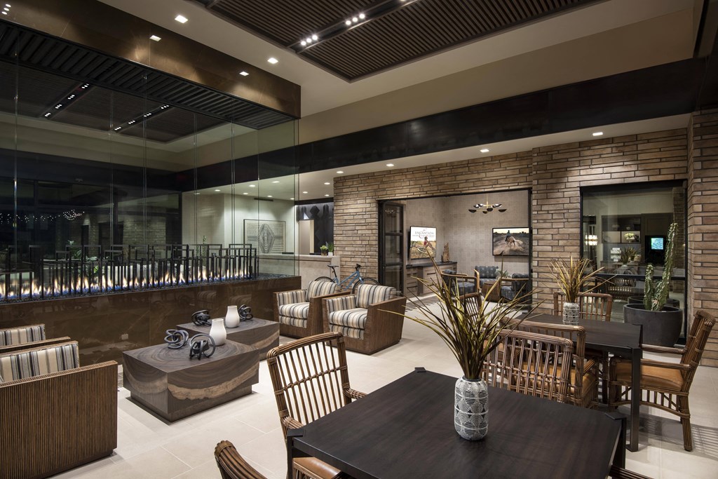 the lobby of a restaurant with tables and chairs