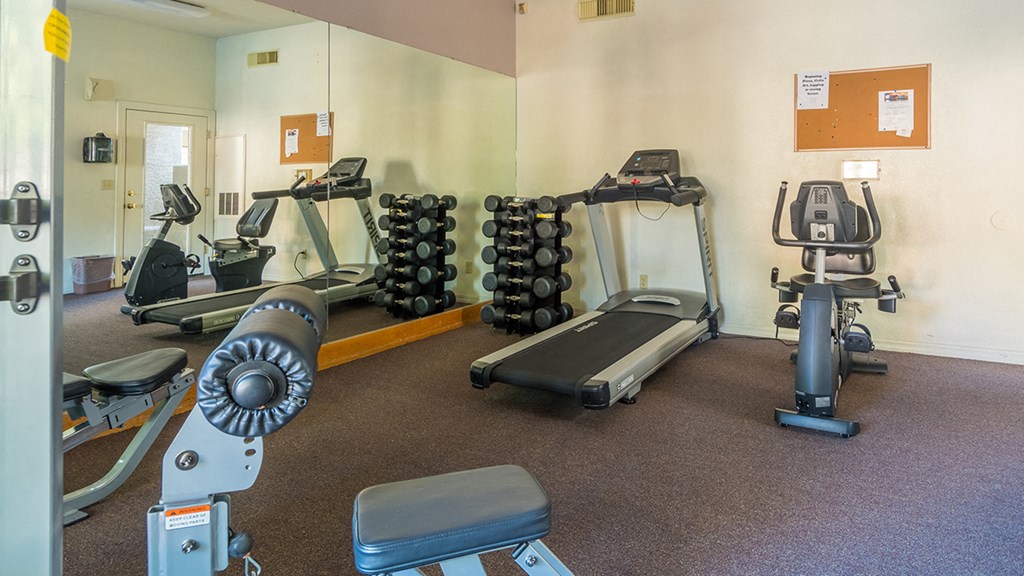 Estancia fitness center with weight machines and fitness equipment
