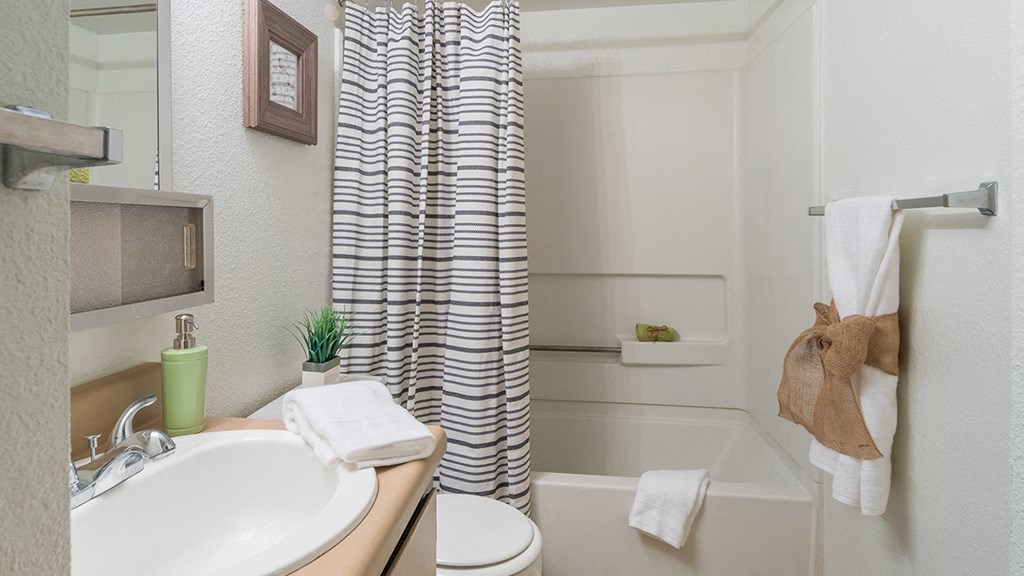 El Encanto bathroom with shower tub combo and a nice sink