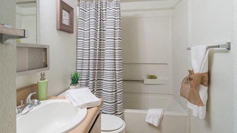 El Encanto bathroom with shower tub combo and a nice sink