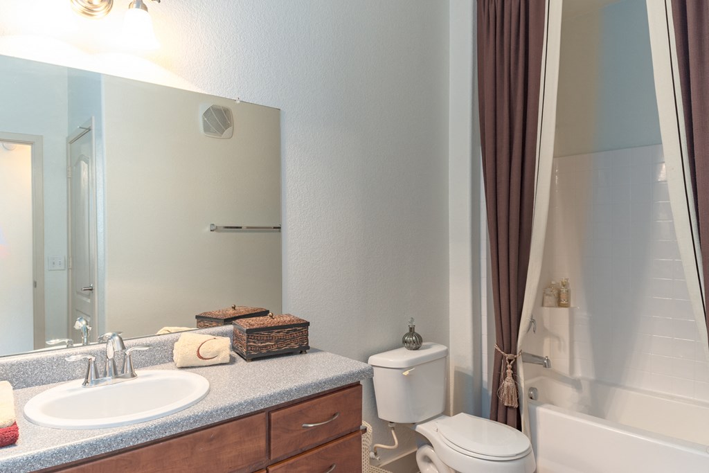 a bathroom with a toilet sink and bathtub