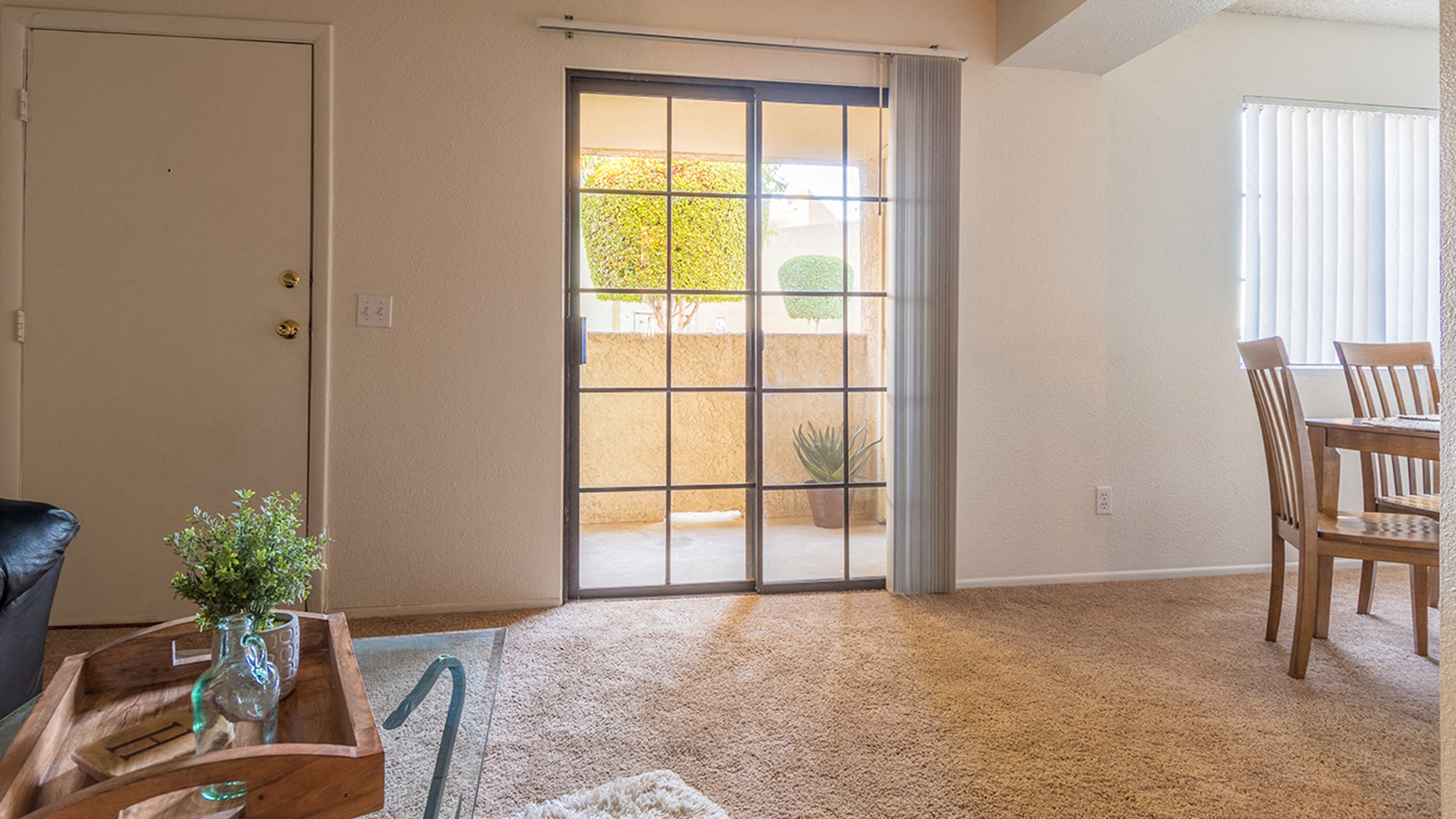 El Encanto living room with sliding glass doors and private balcony