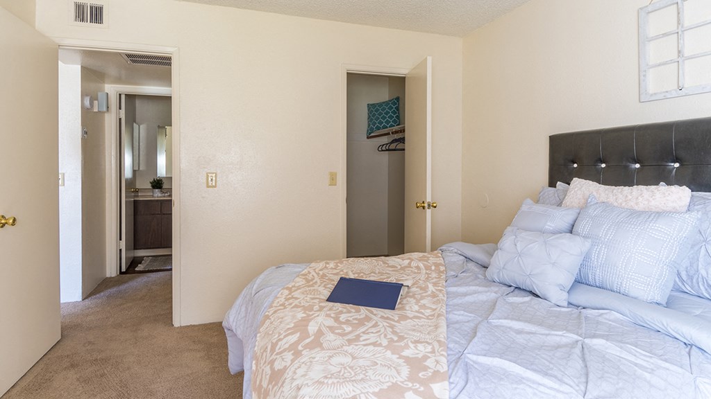 The Springs bedroom with nice natural lighting and carpet flooring