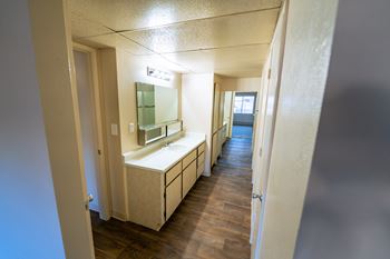 A bathroom with a sink and mirror.