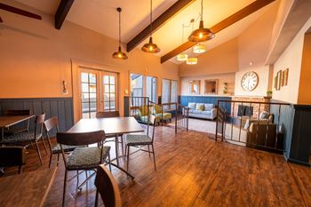 A large room with a long table and chairs.