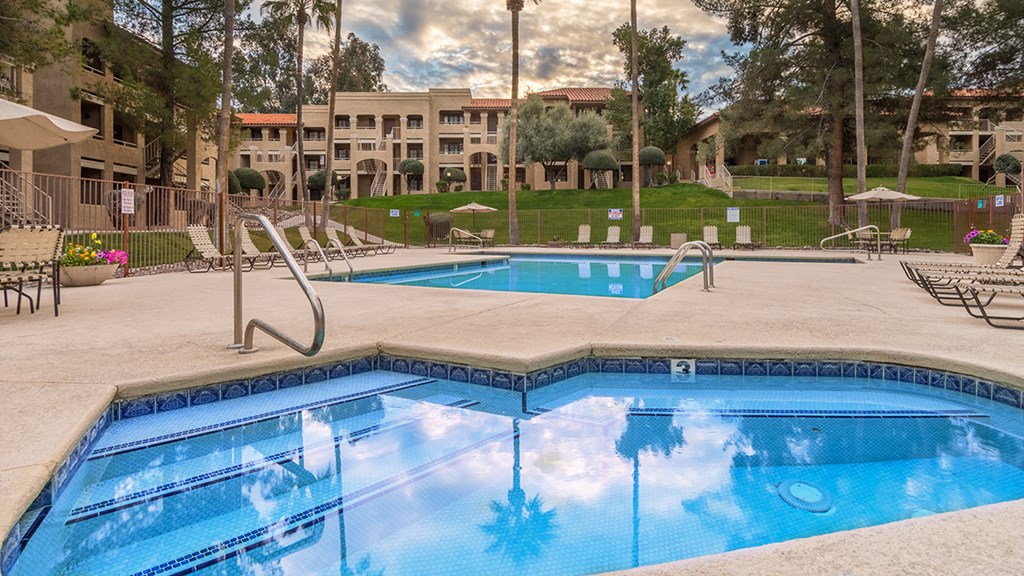 Foothills view of hot tub and spa with relaxation area and grassy area near