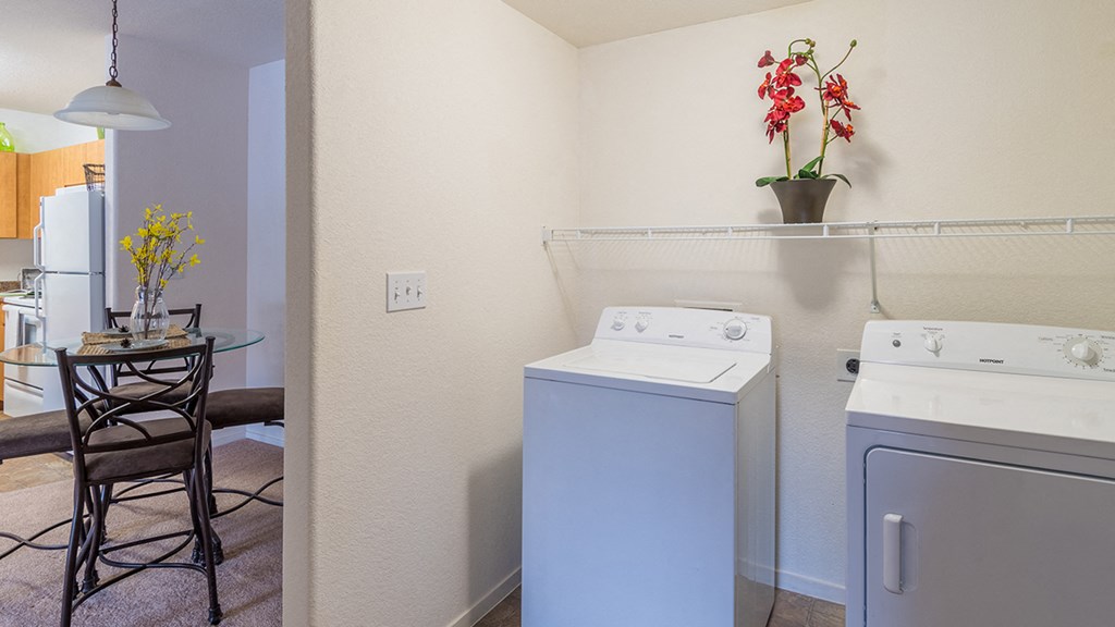 Desert Sands laundry room with standard washer and dryer.
