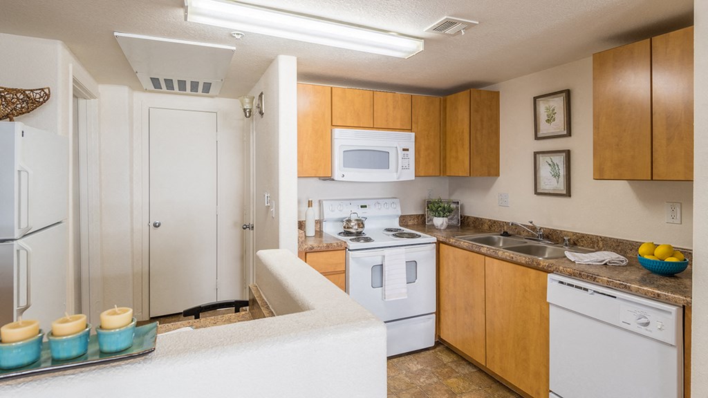 Desert Sands kitchen with all white appliances.