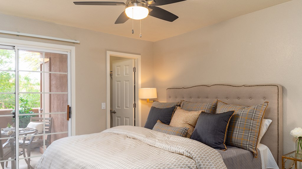 La reserve bedroom with ceiling fan and nice natural lighting
