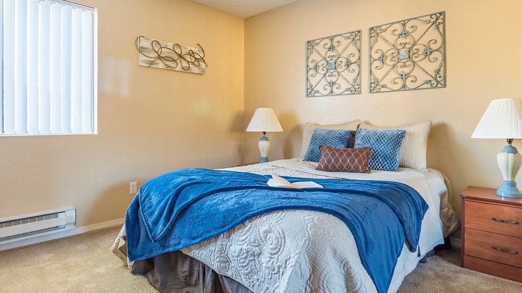 Rio Vista spacious bedroom with natural lighting and carpet flooring
