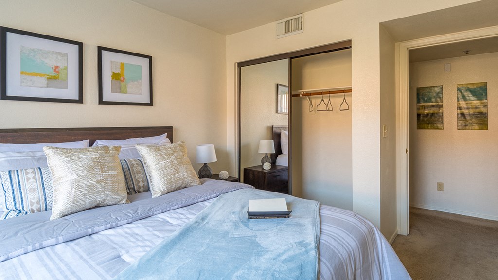 villas at Montebella bedroom with with nice natural lighting, carpet flooring and spacious closets