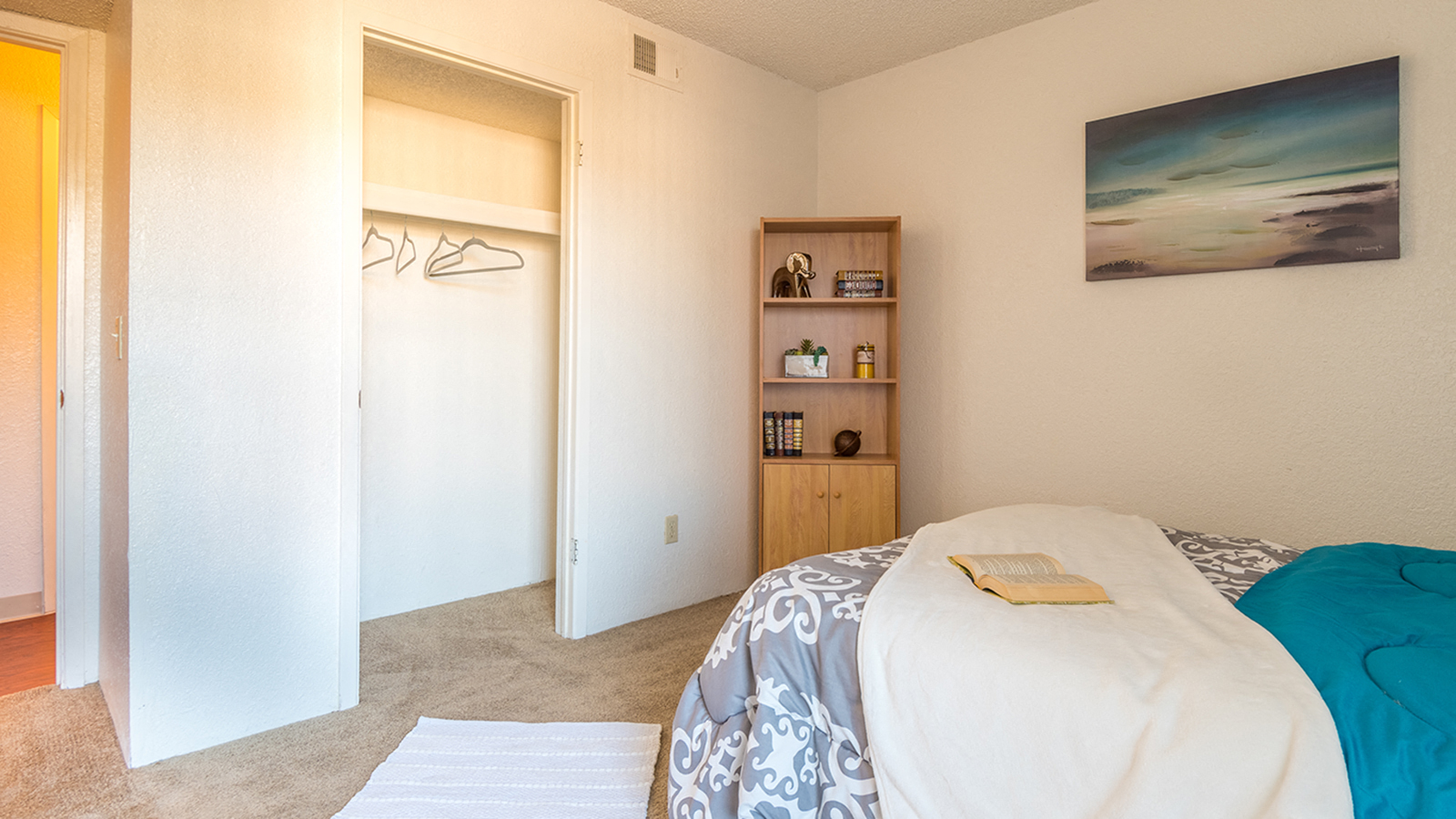Somerpointe bedroom with large closet and carpet flooring