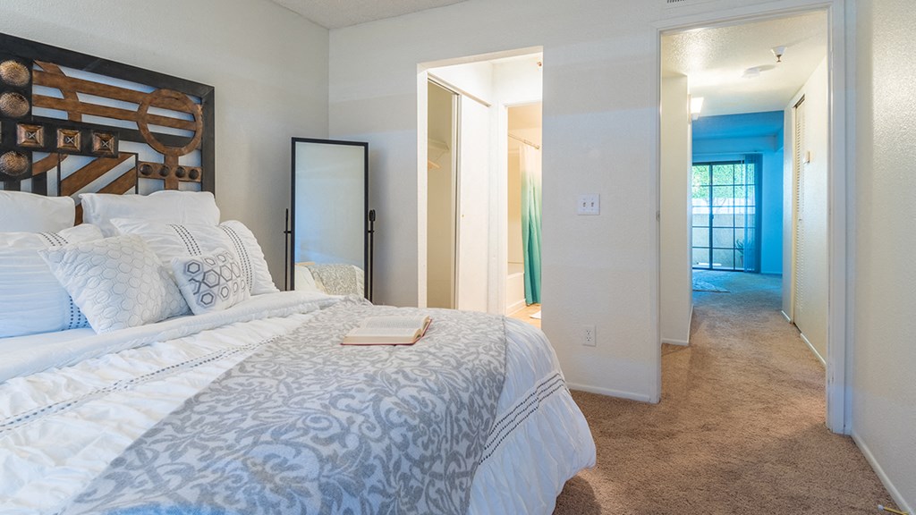El Encanto Spacious master bedroom with bathroom and carpet