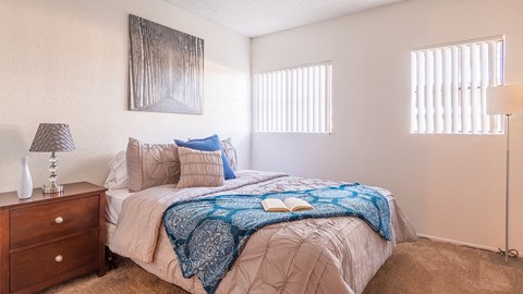 El Encanto second bedroom with nice natural lighting and carpet flooring