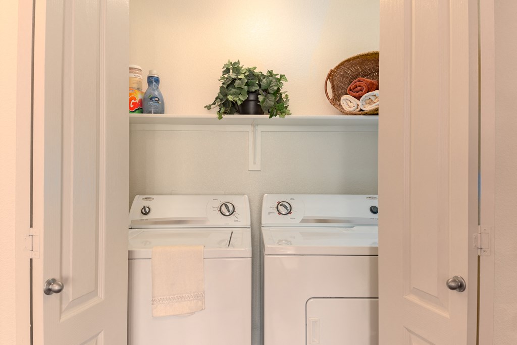 a small laundry room with a washer and dryer