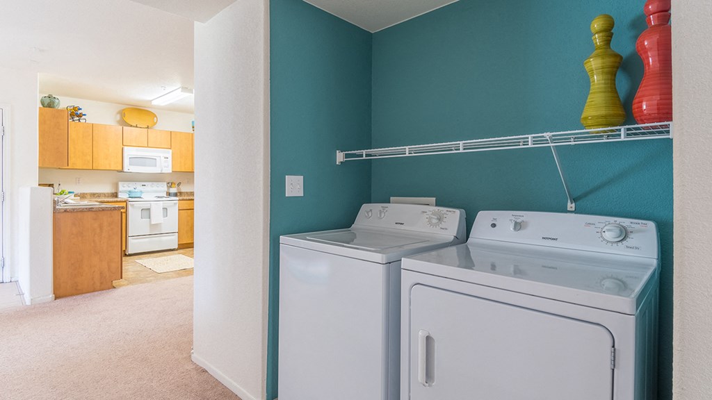 Desert Sands laundry room with a standard washer and dryer.